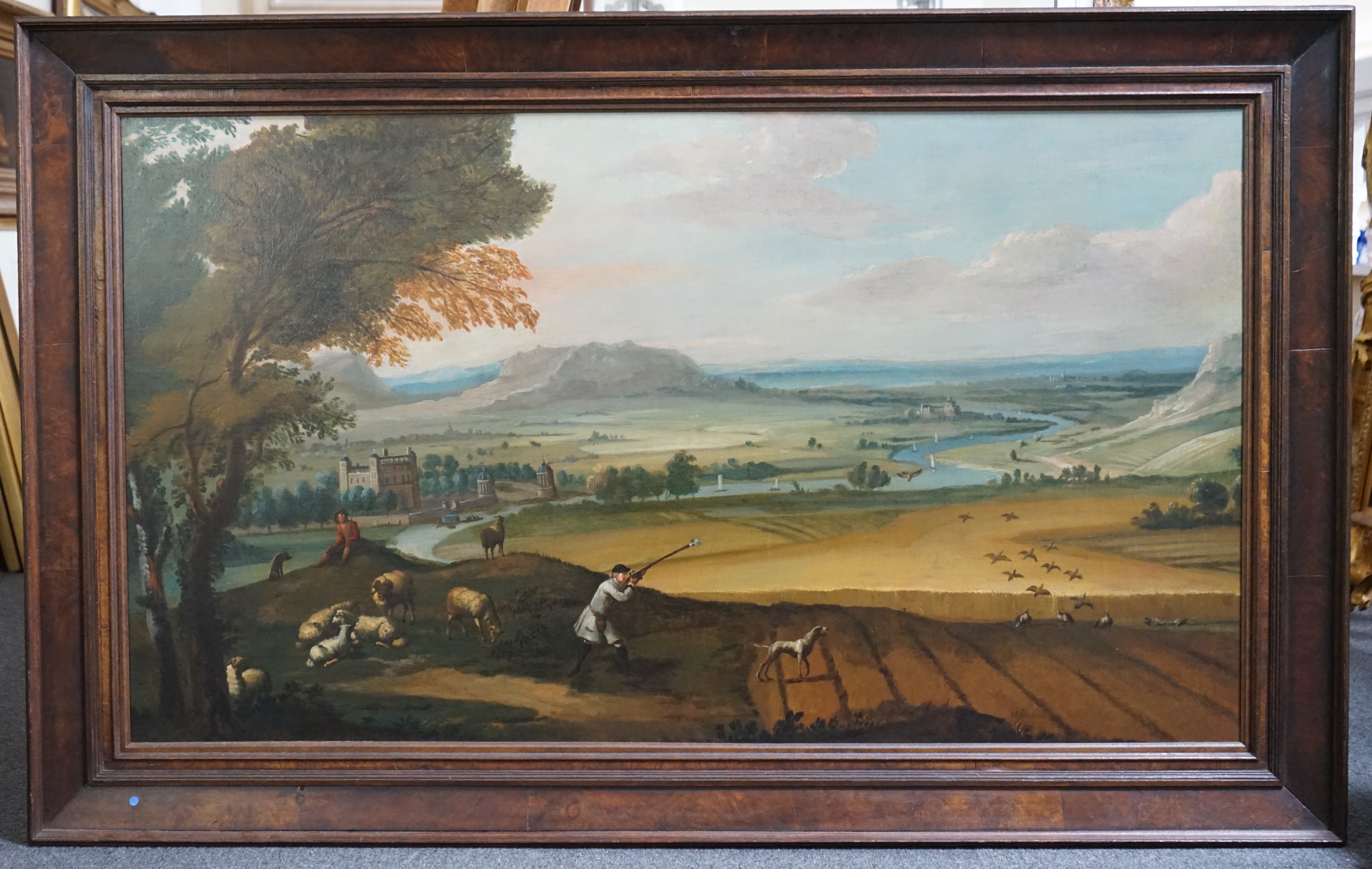 Attributed to John Wootton (English, 1682-1764), Partridge shooting with a view on the upper Avon, oil on canvas, 76 x 131cm